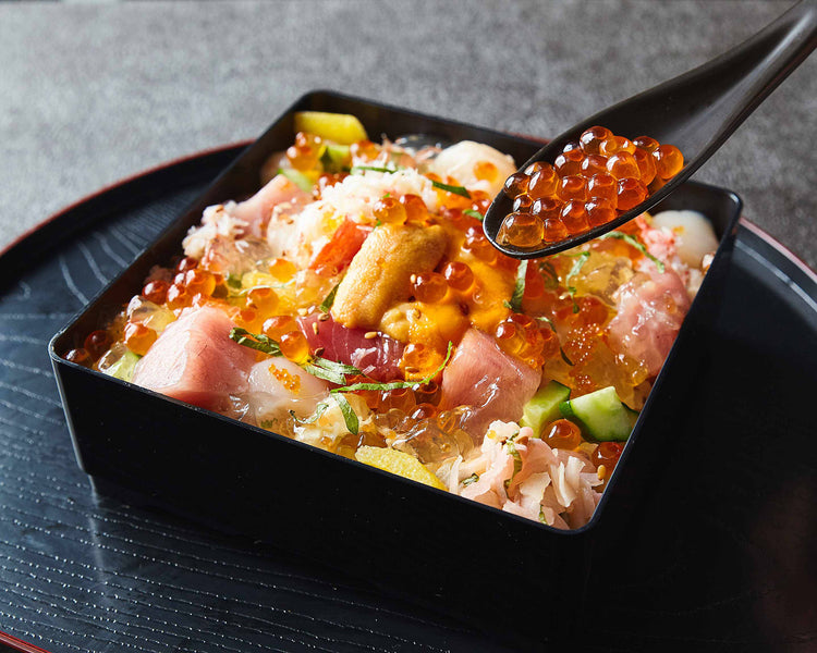 Fresh sea urchin, salmon roe and crab on top